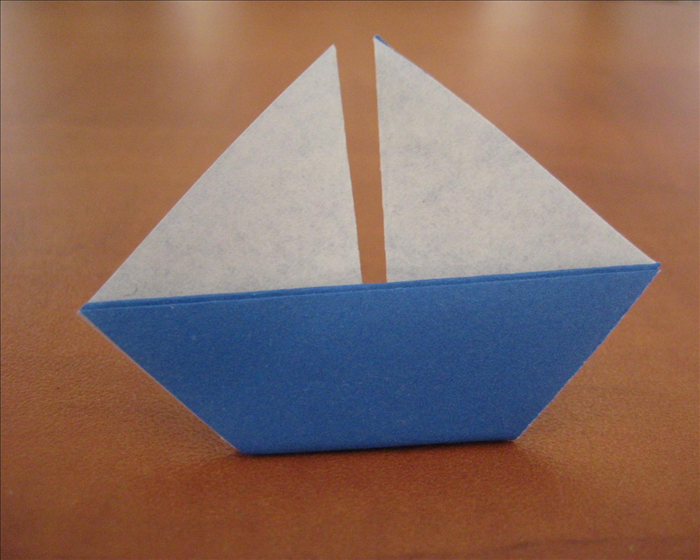 How to fold a simple origami sailboat