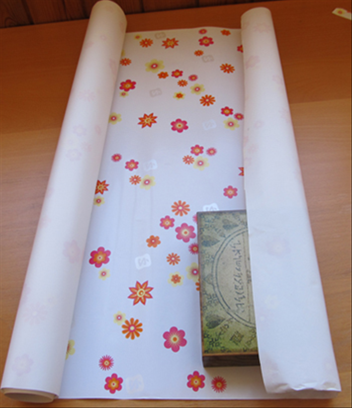 How to Wrap a Gift with a Creative Paper Fan Decoration