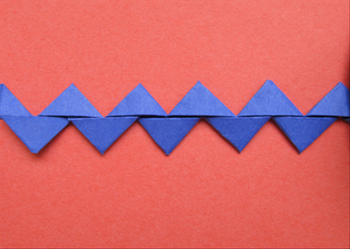 How to fold a strip of paper into a rickrack decoration