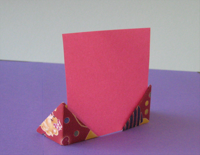 How to fold a picture or note holder, also known as the traditional origami magic pocket.