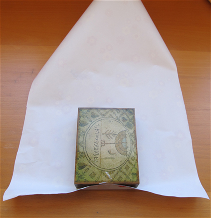 How to Wrap a Gift with a Creative Paper Fan Decoration